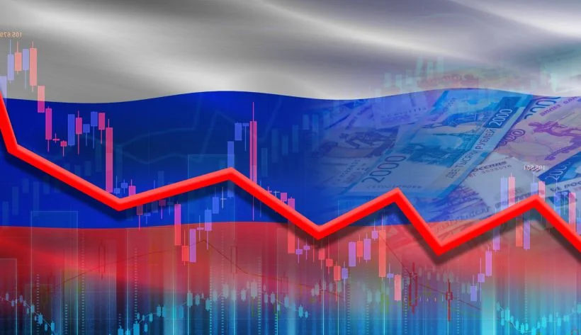 Падаючий графік дефіциту бюджету РФ на тлі прапора та рублів
